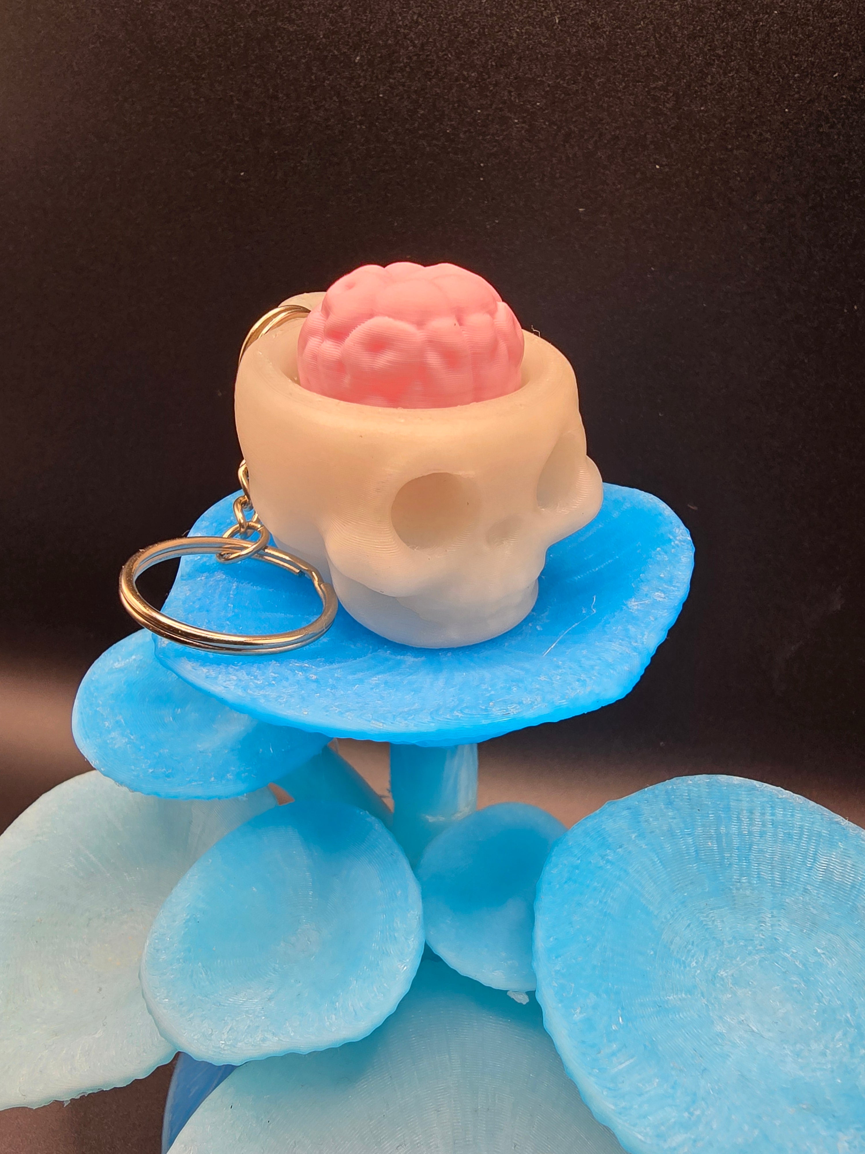 Skull with brain clicker keychain